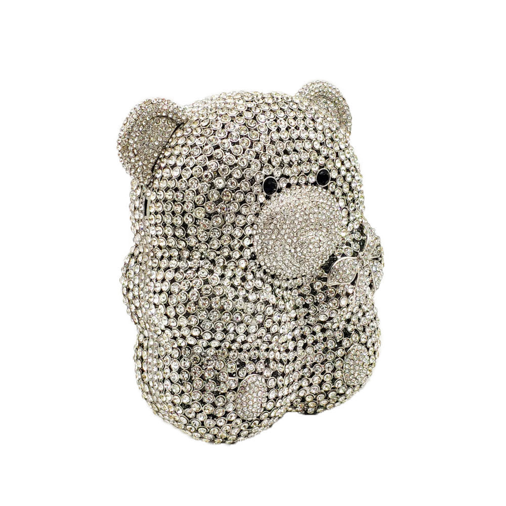 Silver teddy bear-shaped  crystal clutch bag with crystal embellishments on a white background