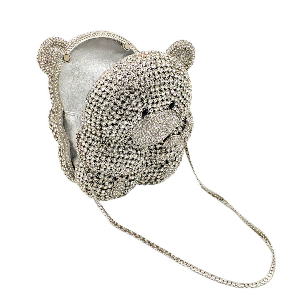Silver crystal teddy bear-shaped clutch bag with rhinestone embellishments on a white background