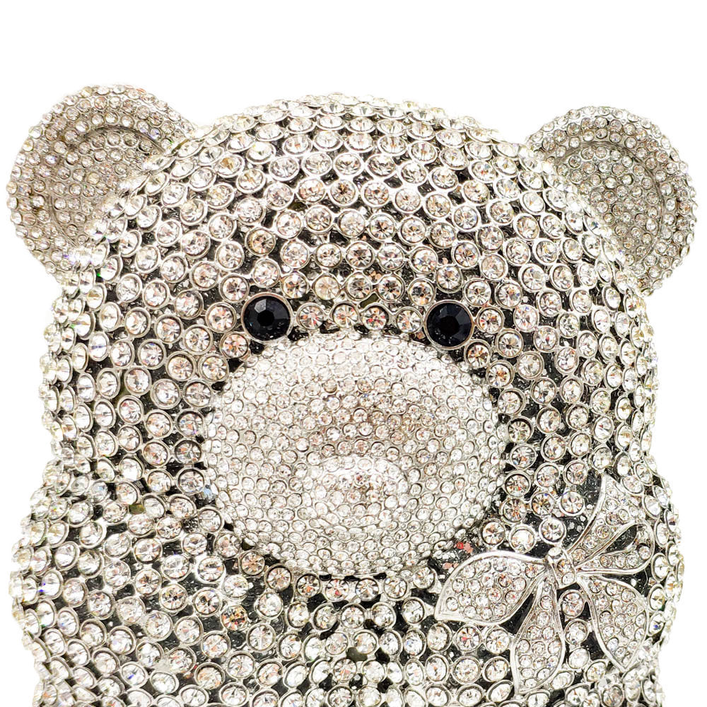 Teddy bear-shaped crystal clutch covered in rhinestones on a white background